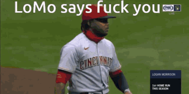 a cincinnati baseball player is standing on the field and says " lomo says fuck you "