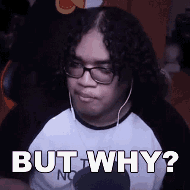 a man with curly hair wearing glasses and headphones is sitting in a chair and says `` but why '' .