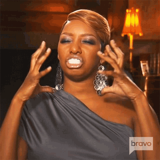 a woman with a bravo logo on the bottom of her dress