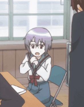 a girl with purple hair is sitting at a desk in a classroom