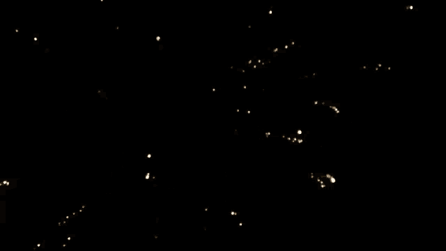 a light is shining through a dark sky at night .