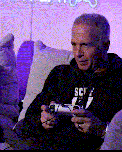 a man playing a video game with a sweatshirt that says sci