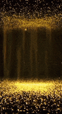 a dark background with a lot of gold glitter falling from the ceiling