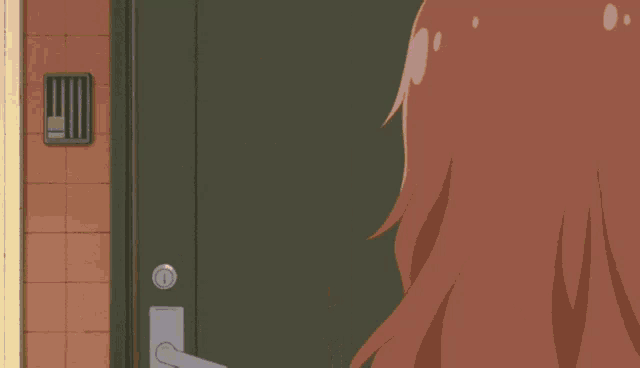 a girl in a pink and white dress stands in a doorway