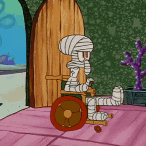 squidward from spongebob squarepants is in a wheelchair with a bandaged leg