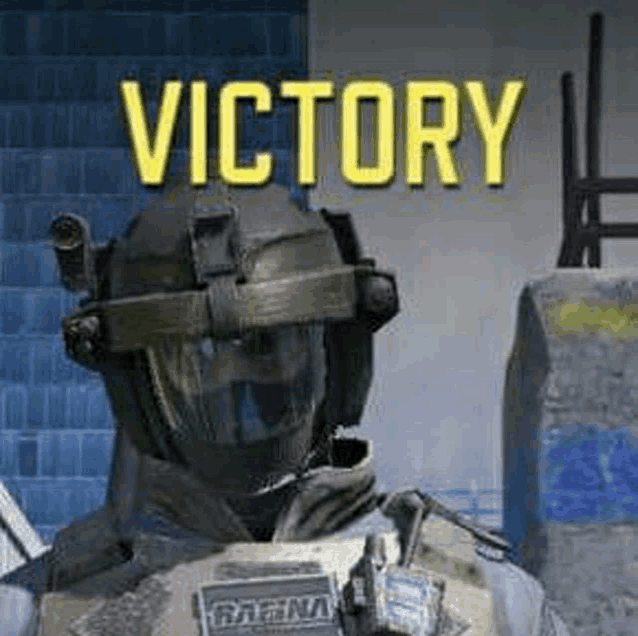 a soldier wearing a helmet and a vest is standing in front of a wall with the words `` victory '' above him .