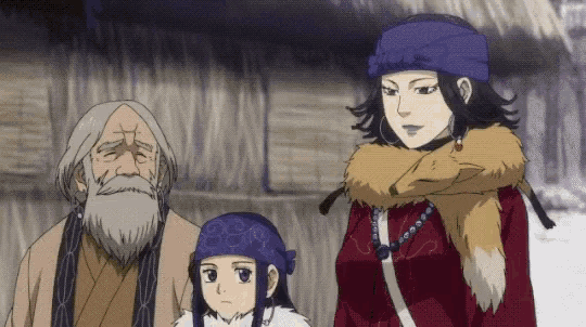 a man with a beard and a woman with a blue hat are standing next to each other