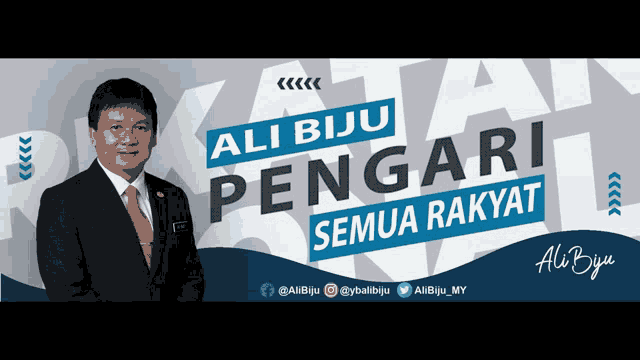 a man in a suit and tie is standing in front of a banner that says ali biju pengari semua rakyat