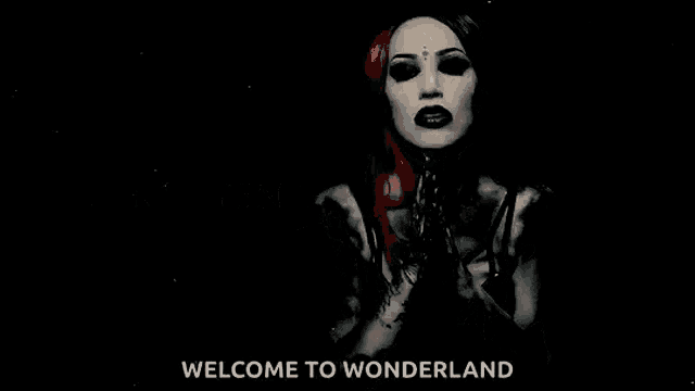 a black and white photo of a woman with the words welcome to wonderland behind her