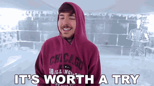 a man wearing a hoodie with the words it 's worth a try below him
