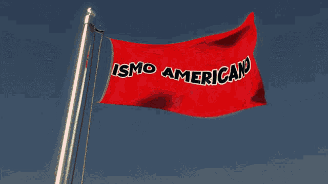 a red flag that says ismo americano is flying in the wind