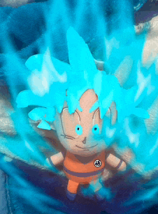 a stuffed cartoon character with blue hair and a circle on his chest