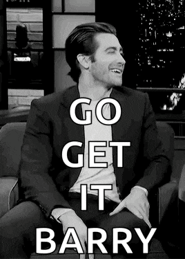 a black and white photo of a man in a suit sitting in a chair with the words go get it barry .