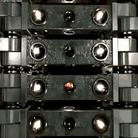 a close up of a machine with a lot of balls in it