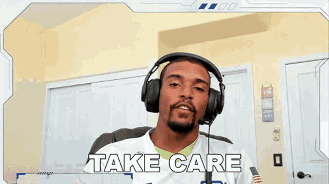 a man wearing headphones says " take care " in front of him