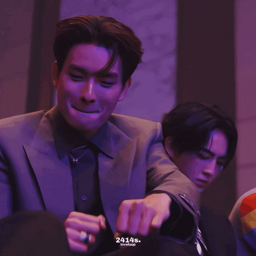 a man in a suit has the number 24145 on the bottom