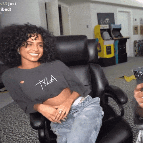 a woman in a crop top with the letter xla on it