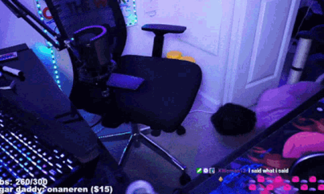 a person is laying on the floor in front of a keyboard and a chair