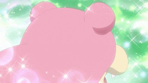 a pink teddy bear with a yellow beak and white eyes is smiling