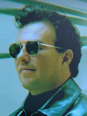 a close up of a man wearing sunglasses and a black leather jacket