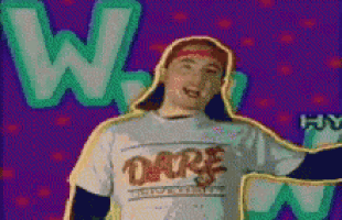 a man wearing a dare t-shirt is dancing