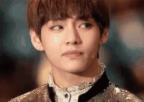a close up of a young man 's face with a tear coming out of his nose .
