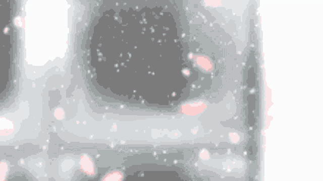 a close up of a gray surface with a lot of bubbles on it .