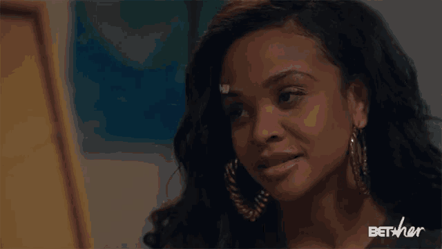 a woman is making a funny face and the word what is on the screen