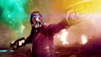 a man in a gas mask is holding a gun