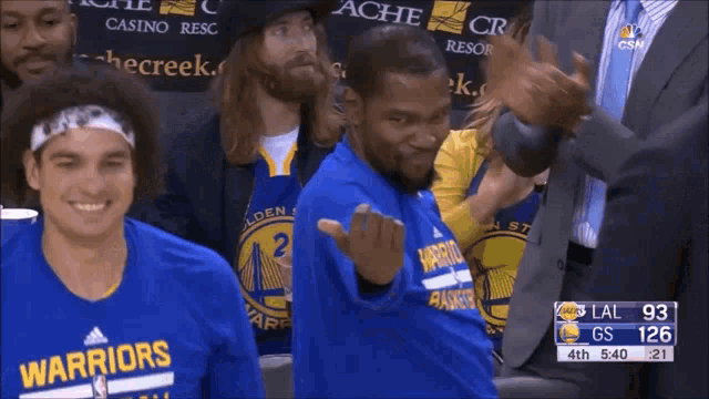 a golden state warriors basketball player giving the middle finger