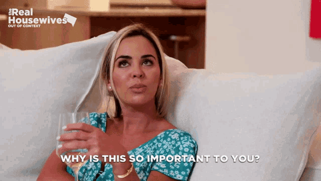 a woman is sitting on a couch with a glass of wine and the words why is this so important to you