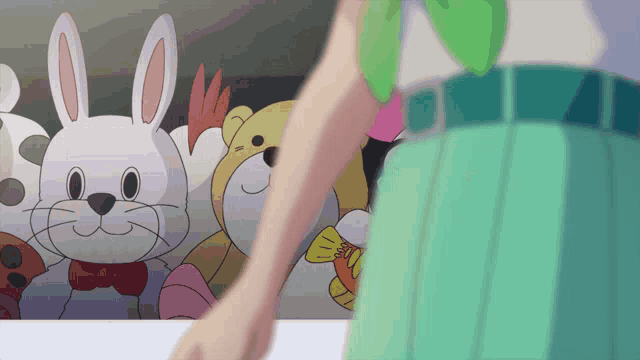 a woman is standing in front of a bunch of stuffed animals including a rabbit and a bear