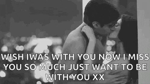 a man and a woman are kissing in a black and white photo with a quote .