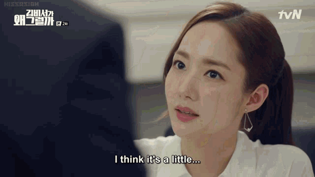 a woman in a white shirt says " i think it 's a little ... "