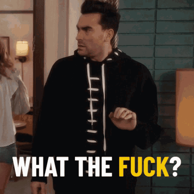 a man wearing a black hoodie says " what the fuck "