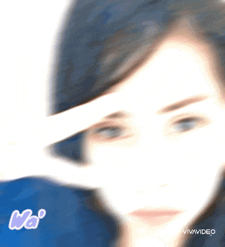 a blurry picture of a woman 's face with the words vivavideo written on the bottom
