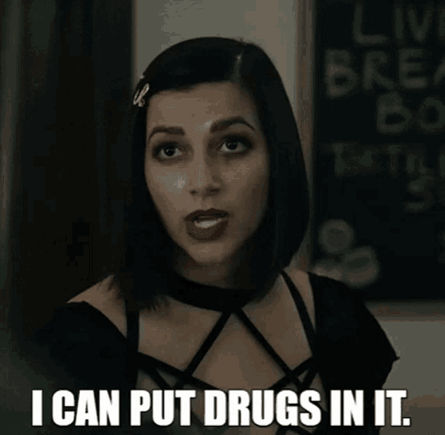 a woman says " i can put drugs in it " in front of a sign