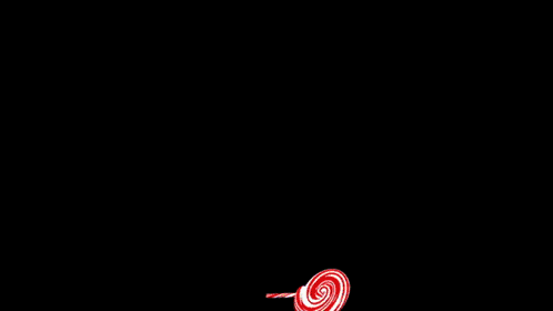 a yellow circle with a black background and a few red stars