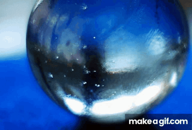a close up of a glass ball with make a gif.com in the corner