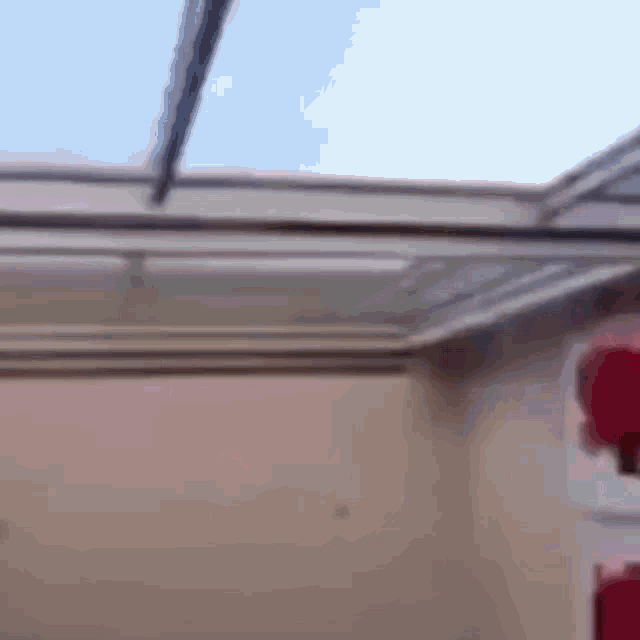 a room with a clear ceiling and a red lantern