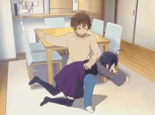 a man is holding a woman in his arms in a living room