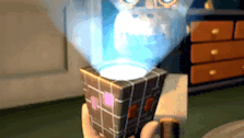 a person is holding a cube in their hand with a light coming out of it