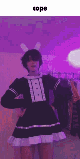 a person is wearing a maid dress with bunny ears .