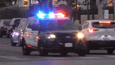a ford police car with a license plate that says nmv-072