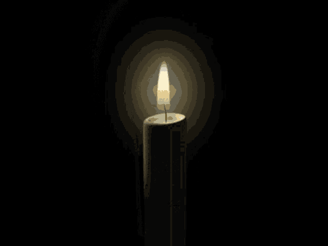a lit candle with a label on it that says ' proyecto ' on it