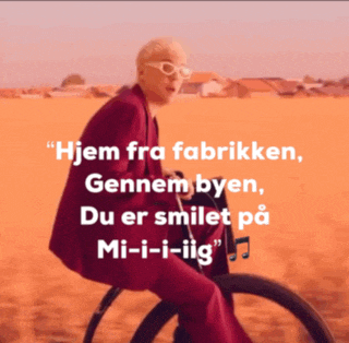 a woman in a red suit is riding a bike with the words " hjem fra fabrikken " on the bottom right