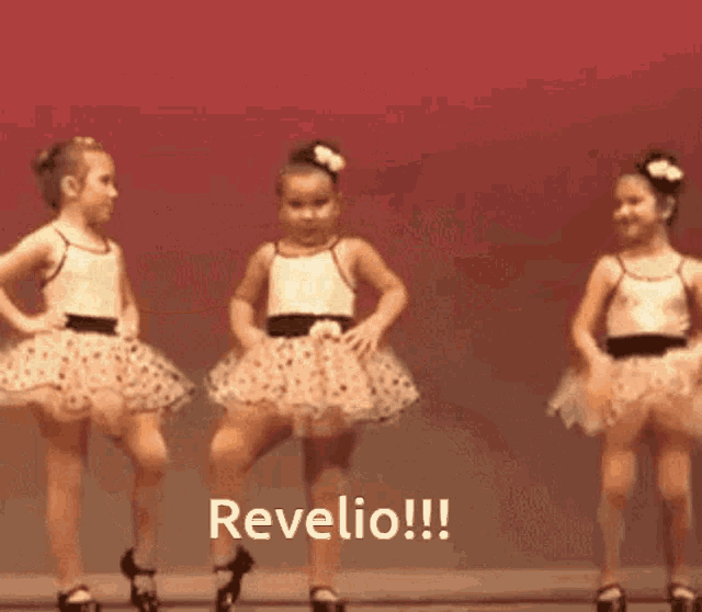three little girls are dancing on a stage and the words revelio are on the bottom