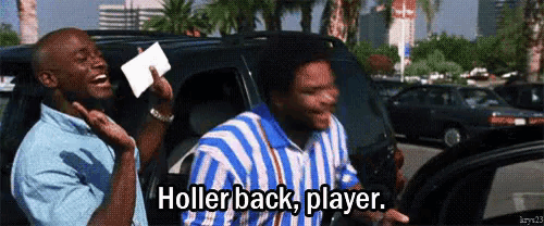 a man in a blue and white striped shirt is holding a card that says hollerback player