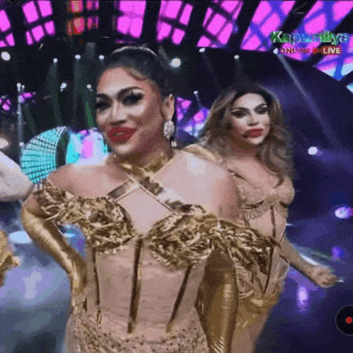 two drag queens on a stage with the words kapamilya on the bottom left