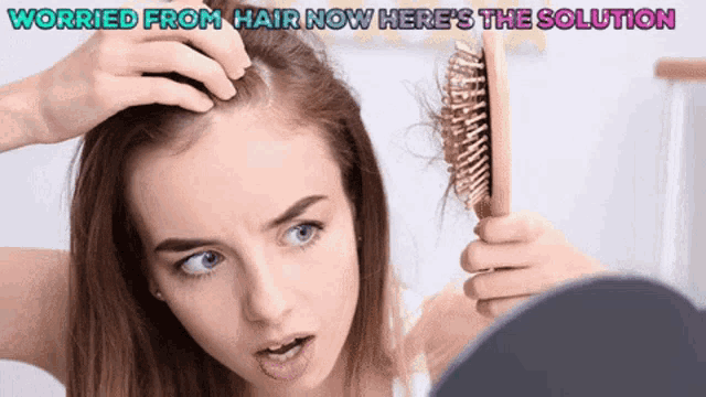 a woman brushes her hair in front of a mirror with the words worried from hair now here 's the solution above her